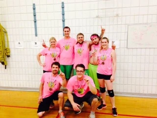 Team Spirit at Its Best - Energetic team in bright pink jerseys showing enthusiasm